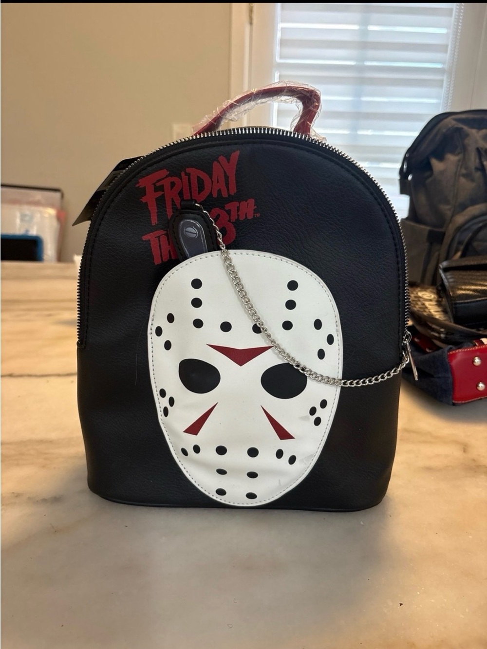 Source Unknown Black Mini Backpack with White Jason Mask and Red Accents